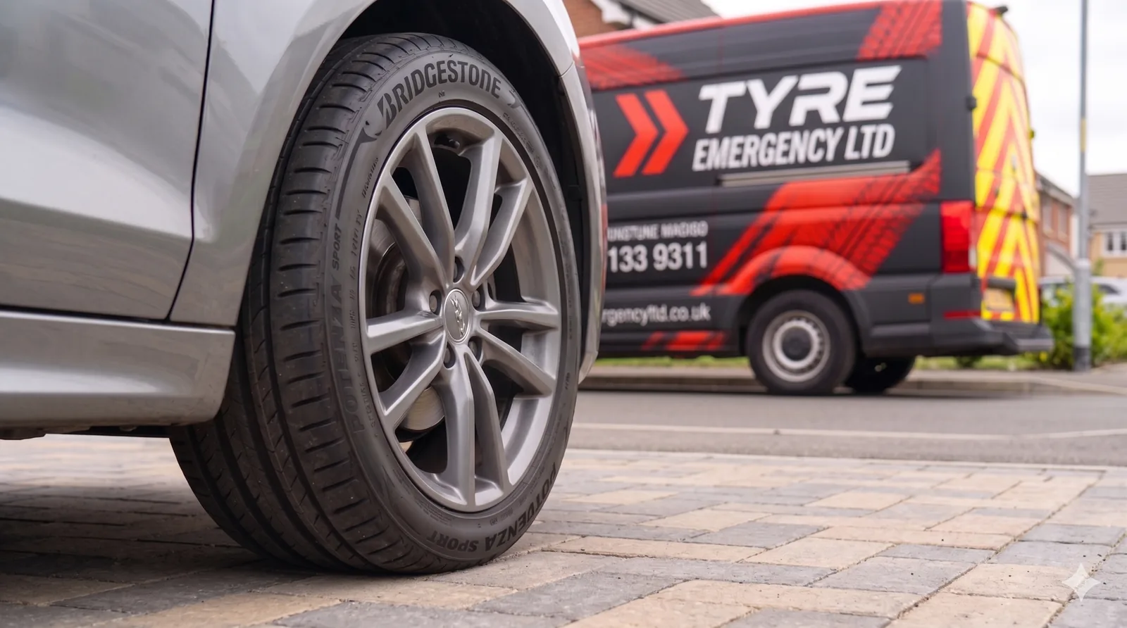 A newly fitted Bridgestone tyre with the Tyre Emergency Ltd service van in the background